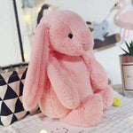 gros lapin en peluche rose