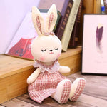 lapin blanc peluche rose