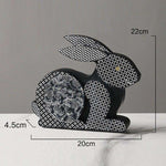 statue lapin nordique couche